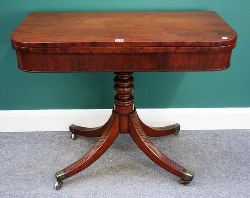 A George III mahogany card table, the D shaped top on turned column and four downswept supports, 92cm wide.