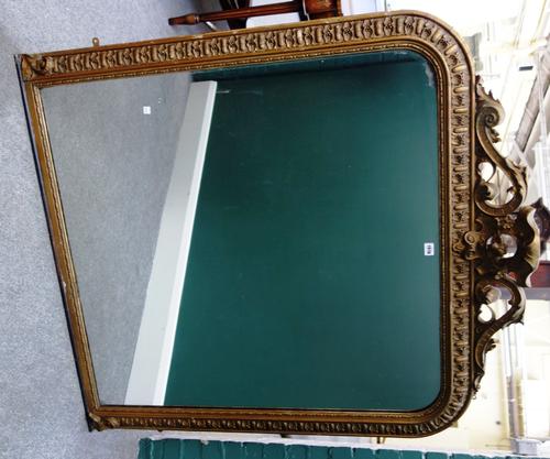 An early Victorian gilt framed overmantel mirror, with pierced cartouche crest and egg and dart moulded frame, 118cm wide x 133cm high.