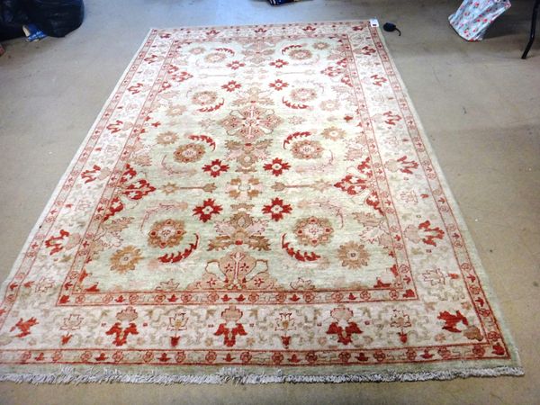 A sage patterned Turkish carpet, 273 x 186cm.