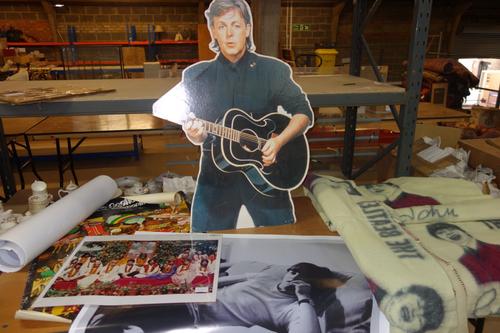 A quantity of Beatles memorabilia, including; three Witney blankets printed with the four members, 'Yellow Submarine' posters and various photos and s
