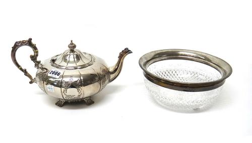 A silver teapot, of compressed melon fluted form, with a scrolling handle, in a Victorian design, Birmingham 1969 and a silver mounted, faceted glass