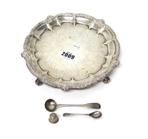 Silver, comprising; a Victorian shaped circular salver, decorated with a cast border and raised on four scrolling feet, diameter 20.5cm, London 1874,