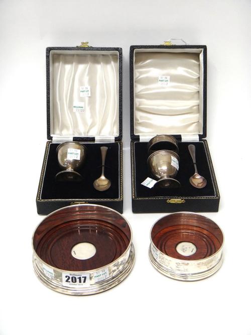 Silver and silver mounted wares, comprising; a circular bottle coaster, diameter 12cm, a small circular bottle coaster, diameter 9cm, both having turn