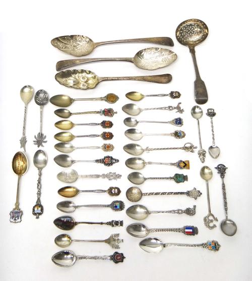 Silver flatware, comprising; two later decorated dessert serving spoons, a bottom marked berry spoon, a fiddle pattern sugar sifting spoon, London 185
