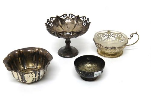 Silver, comprising; a cup with pierced decoration, having a frosted glass liner by Mappin & Webb, London 1930, a bowl of panelled form, Sheffield 1902