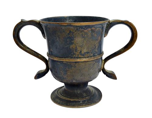 A late George II silver twin handled cup, on a circular foot, height 12.5cm by John Langlands, Newcastle 1759, weight 319 gms. Illustrated