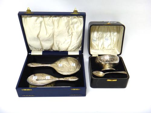 A silver christening bowl and spoon, decorated with an engraved band, the bowl presentation inscribed, Birmingham 1928, weight 217 gms, cased and a si