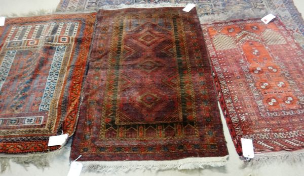 An Afghan prayer rug, 124cm x 80cm, and two Belouche rugs, (3).  G2