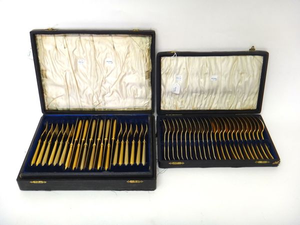 A set of twelve Victorian silver gilt, double struck, bead edged Old English pattern dessert spoons, crest engraved, London 1864, weight 626 gms, also