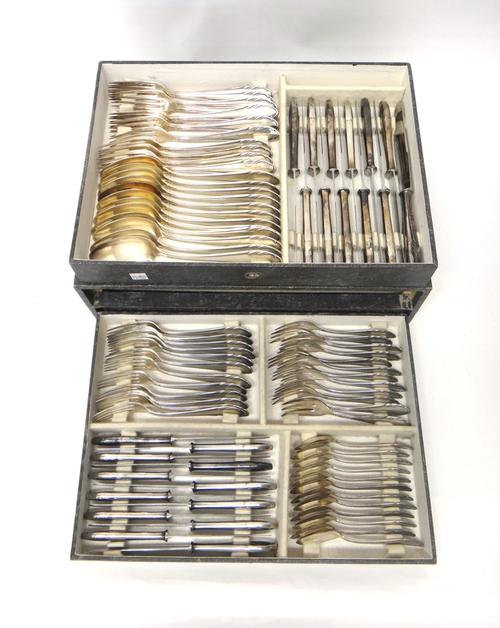 A German silver plated canteen of table flatware, comprising; twelve table forks, twelve tablespoons, twelve table knives, having steel blades, twelve
