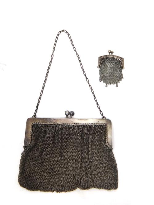 A lady's silver chain mesh evening bag, with a snap clasp, fitted with a carrying chain, import mark Birmingham 1904, weight 175 gms and a European ch