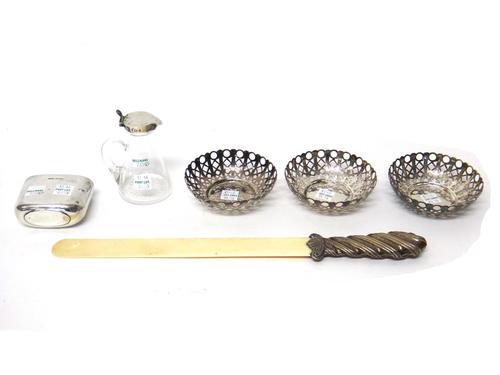 A Victorian silver handled ivory bladed page turner, Chester 1888, a silver mounted glass whisky noggin, by Heath & Middleton, Birmingham 1903, a silv