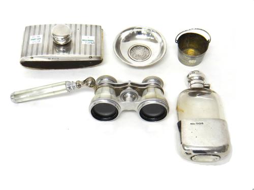 A silver mounted glass spirit flask, with a pull-off beaker base, Sheffield 1910, a silver mounted desk blotter, Birmingham 1926, a European parcel gi