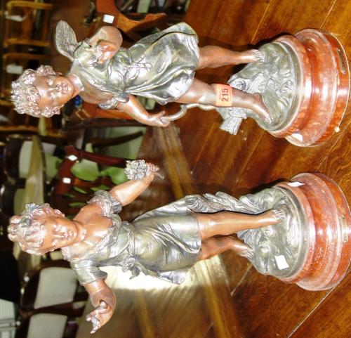 A pair of spelter figures, early 20th century, 'Amour & Innocence' each raised on a faux marble base, signed Biuchon, 43cm high, (2).  ROS