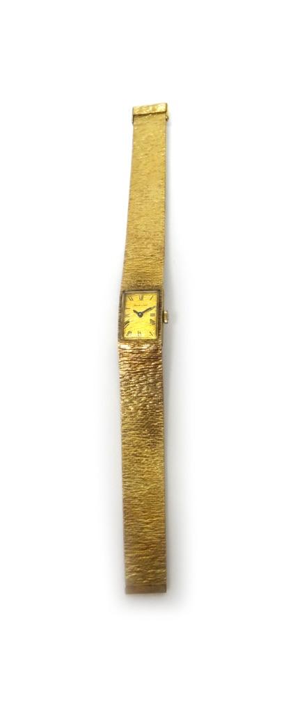 A lady's 9ct gold Bueche-Girod bracelet wristwatch, the signed rectangular bark textured gilt dial, with black Roman numerals, on a bark textured brac