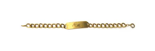 A gold curb link identity bracelet, initial engraved to the central panel, length 19.5cm, weight 25.3 gms.