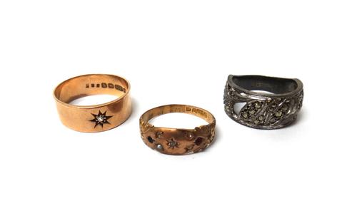 A 9ct gold and diamond set wide band ring, star gypsy set, with a cushion shaped diamond, Birmingham 1917, ring size T and a half, a 9ct gold and gem