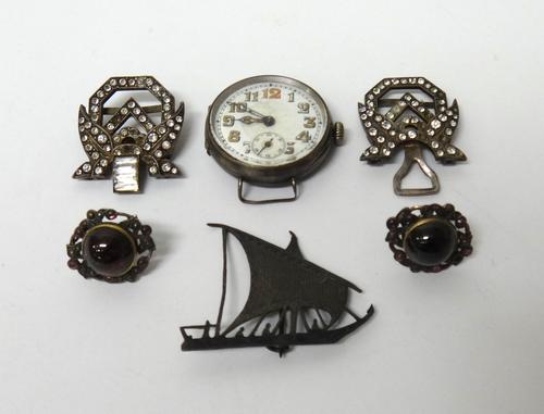 A pair of carbuncle garnet set oval earstuds, the backs with post and butterfly clip fittings, a silver circular cased wristwatch, import mark London