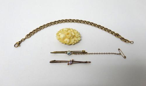 A 9ct gold multiple link bracelet, on a sprung hook shaped clasp, length 20cm, weight 5.6 gms, two gold and gem set bar brooches and a carved bone ova