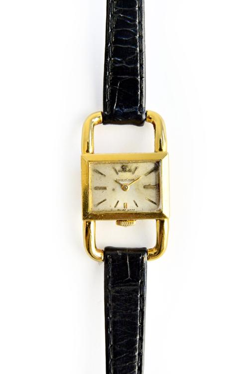A lady's 18ct gold cased Jaeger-le Coultre wristwatch, with a signed jewelled movement, the signed rectangular dial with baton numerals, detailed with