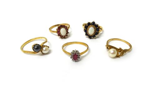 A 9ct gold, opal and sapphire oval cluster ring, a gold, opal and ruby oval cluster ring, detailed 9 CT, a 9ct gold ring, mounted with a cultured pear