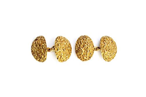 A pair of 18ct gold cufflinks, the backs and the fronts of dished oval form, with a textured finish, detailed PP&P P3496, London 1972, combined weight