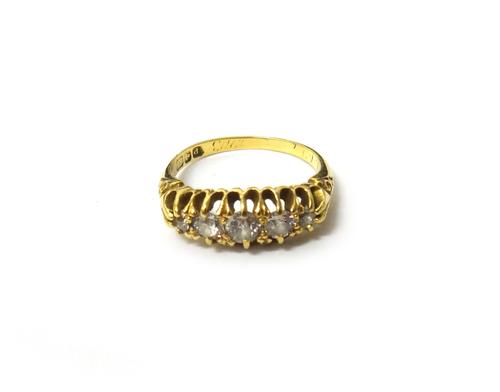 An 18ct gold and diamond five stone ring, mounted with a row of cushion shaped diamonds graduating in size to the centre stone, Birmingham 1903, ring