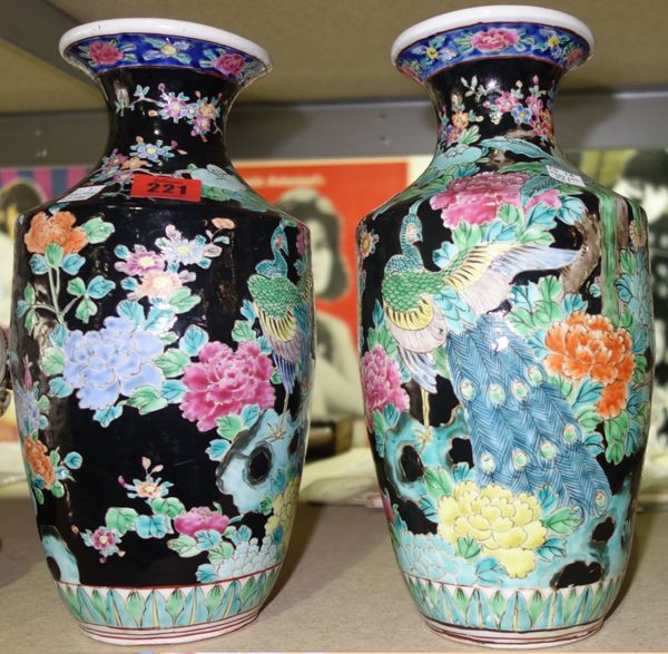 A pair of Japanese black ground porcelain vases.   ROS