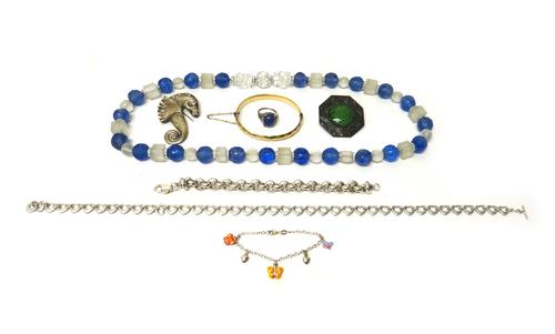 A 9ct gold and seed pearl set brooch, designed as a heather spray, a gold, ruby and gem set pendant cross, a blue and colourless glass bead necklace,