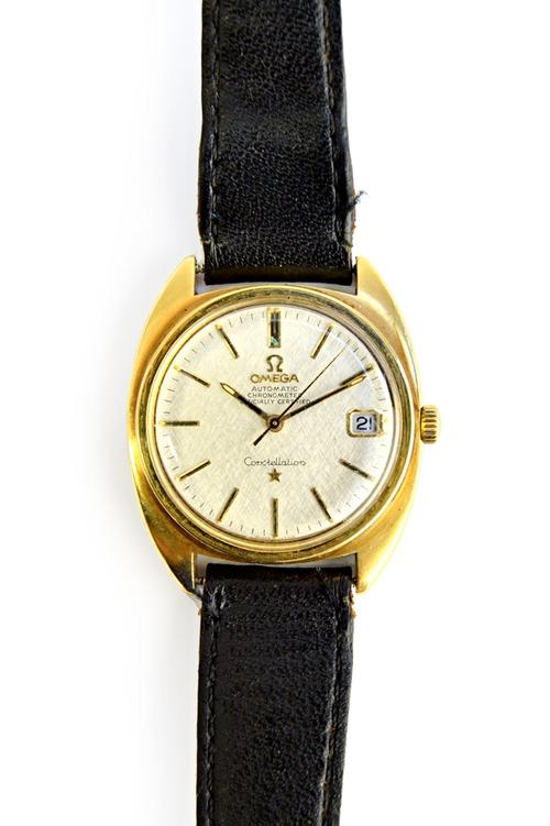 A gentleman's gilt metal fronted and steel backed Omega Automatic Constellation wristwatch, the signed circular silvered dial with baton shaped numera