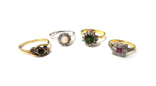 A gold, diamond and red gem set nine stone square cluster ring, detailed 18 CT, a white gold and platinum, diamond and opal set cluster ring, detailed