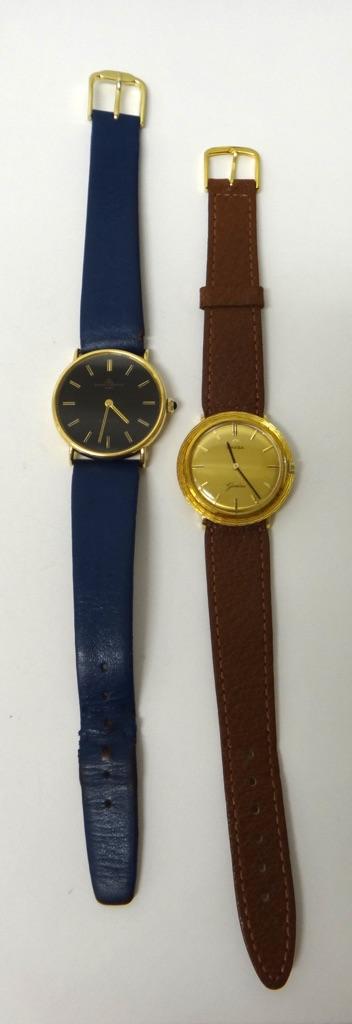 A gentleman's 18ct gold circular cased Baume & Mercier Baumatic wristwatch, the signed circular black dial with baton shaped numerals, the case back p