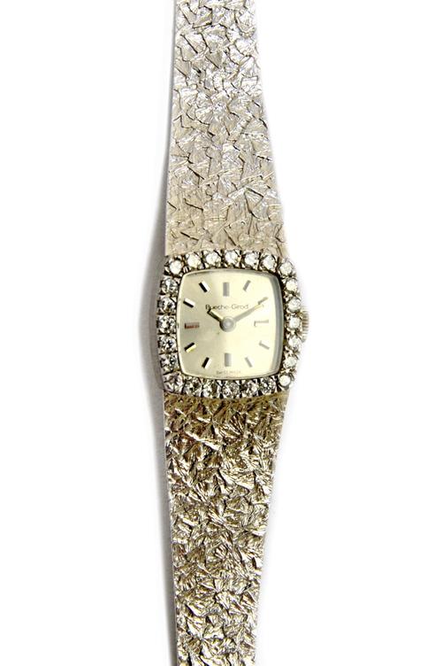 A Bueche-Girod 9ct gold and diamond set lady's dress bracelet wristwatch, the signed curved square silvered dial with baton shaped numerals and with p
