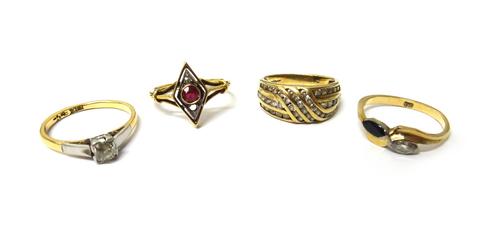 A gold and platinum, diamond set single stone ring, mounted with a cushion shaped diamond, a gold, diamond and sapphire set two stone ring, in a twist