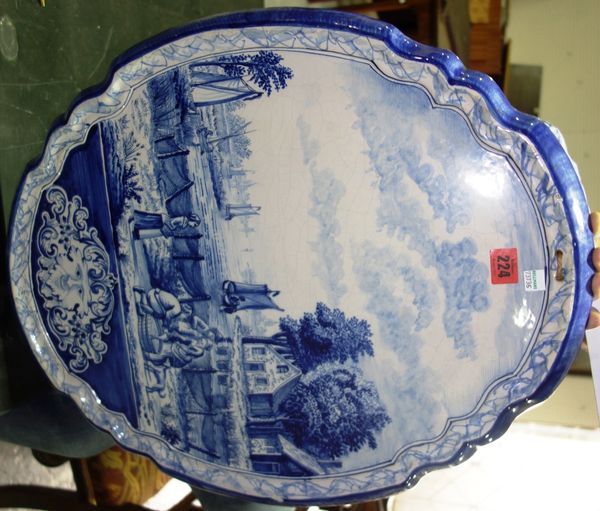 A Dutch Delft wall plaque, late 19th century depicting a lakeland scene. DISPLAY