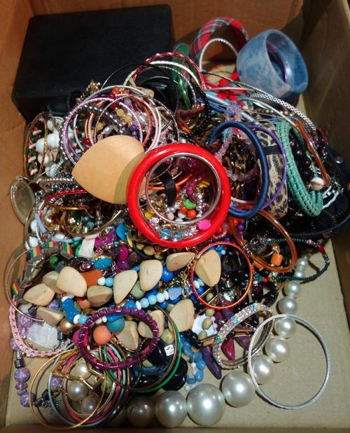 A Victorian opal and diamond set pendant brooch, of circular openwork form, mounted with a cushion shaped diamond at the centre, in a surround of six