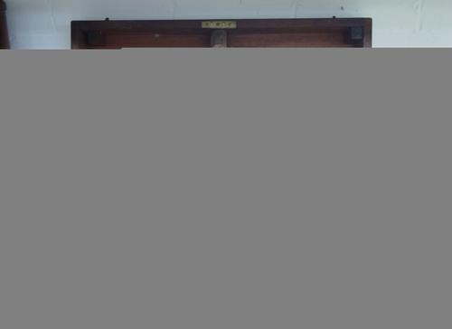 A gold and diamond set five stone ring, mounted with a row of cushion shaped diamonds, graduating in size to the centre stone, ring size N.