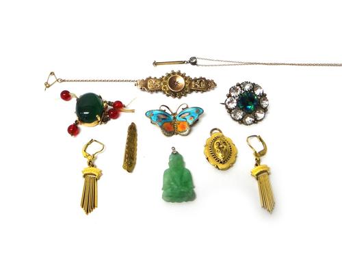A carved jade Buddha pendant, a gold and oval green gem set clasp, detailed 14 K, a Norwegian silver gilt and enamelled butterfly brooch, a 9ct gold a
