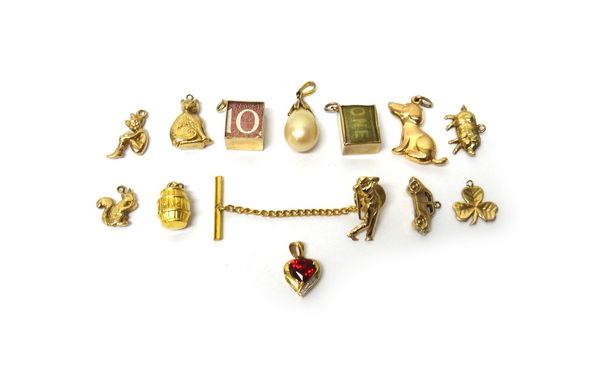 Ten 9ct gold charms, including; a squirrel, a cat, a dog and a pig, combined gross weight 11.5 gms, two pendants and a gold tie stud, designed as a go