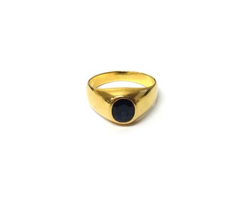 A gold and sapphire set single stone signet style ring, mounted with an oval cut sapphire, detailed 750, ring size Q and a half, gross weight 5.6 gms,