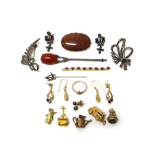 Three gold charms, comprising; a fire engine, a windmill and a garden roller, three further charms, two marcasite set brooches, two further brooches,