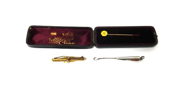 A 9ct gold and seed pearl set bar brooch, Chester 1902, a gold topped and diamond set stick pin, cased and a silver and agate set glove button hook, B