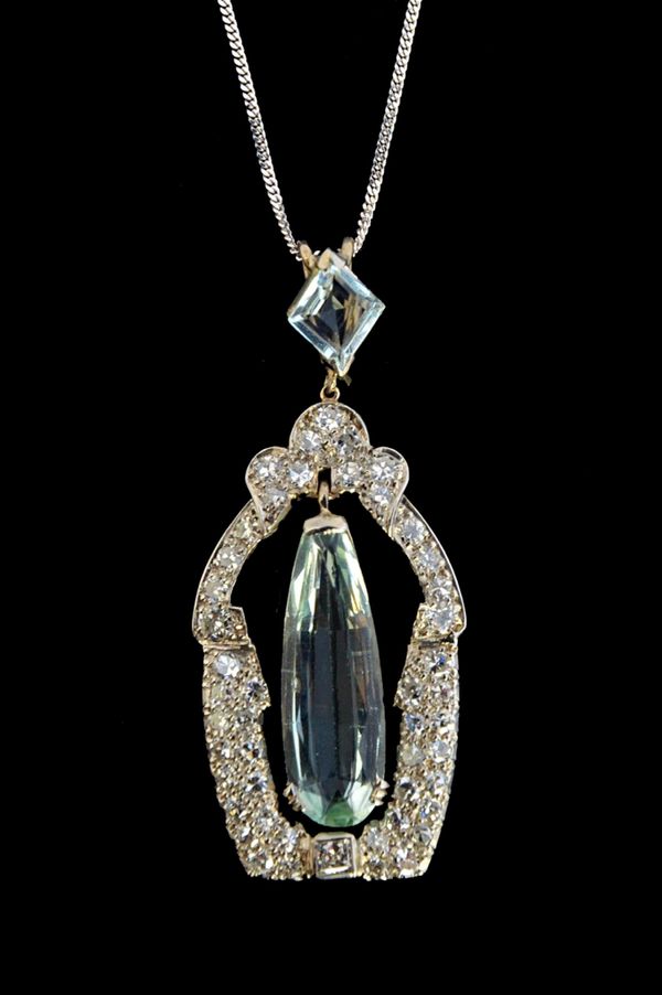 A diamond and aquamarine pendant, of panel shaped openwork form, mounted with a drop shaped aquamarine to the centre, the surround mounted with circul