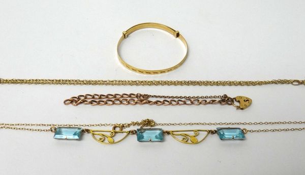 A gold and pale blue paste set necklace, pierced with foliate divisions, a 9ct gold baby's bangle, a gold curb link bracelet, on a 9ct gold heart shap