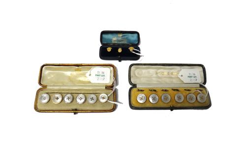 A set of three gold and diamond set dress studs, each mounted with a cushion shaped diamond, cased, six various mother of pearl dress buttons, includi