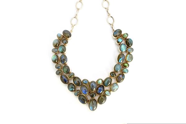 A silver and labradorite collar necklace, mounted with vary sized oval cabochon labradorites, fitted to a silver oval link collar chain, with a T bar