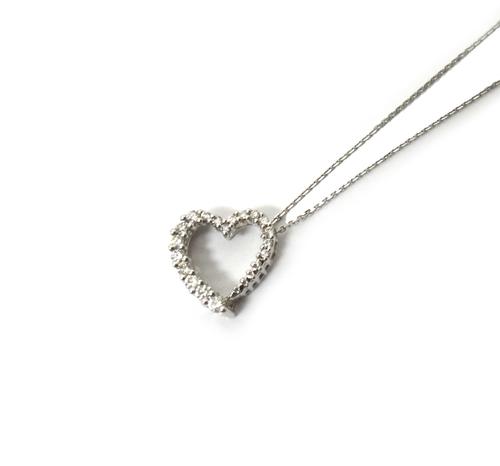 An 18ct white gold and diamond set open heart shaped pendant, mounted with circular cut diamonds, on an 18ct white gold neckchain, with a boltring cla