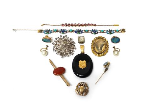 A Victorian oval black onyx set pendant locket, a gold and agate set bar brooch, three further brooches, a garnet set bracelet, an enamelled bracelet,
