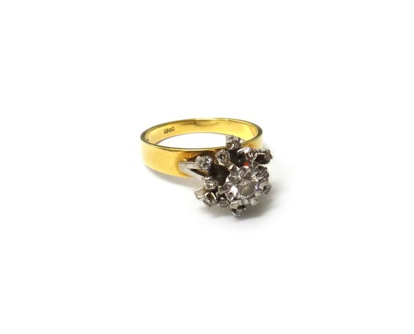A gold and diamond set cluster ring, mounted with the principal circular cut diamond at the centre, in a surround of smaller circular cut diamonds, be