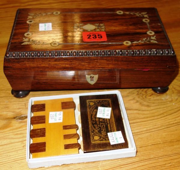 A 19th century rosewood sarcophagus shaped box, containing gaming counters. CAB